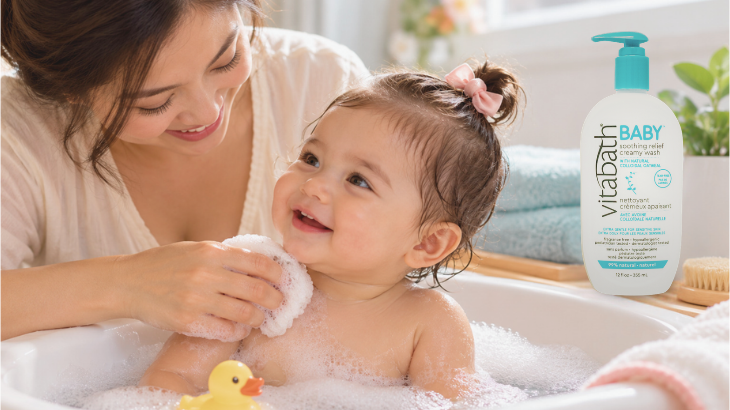 Mom bathing baby with Vitabath Baby Soothing Relief Creamy Wash